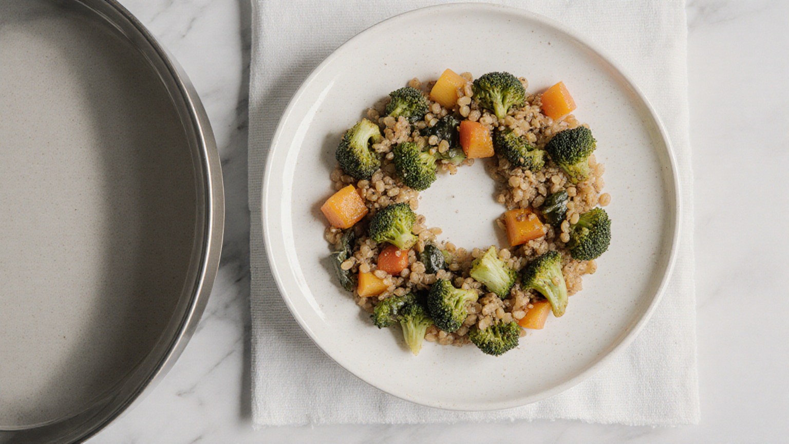 Cooked vegetables and grains arranged in a shallow ring